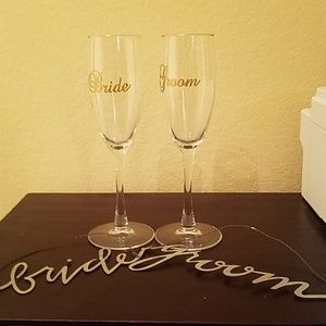 Bride and groom champagne glasses with metal signs